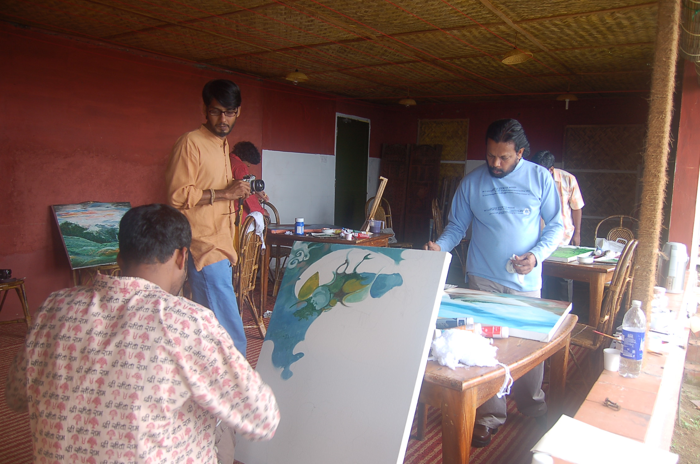 Artists working together during a Blackberry Hills monsoon art gathering